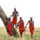 maasai-men-standing-by-a-tree-in-the-masai-mara-1600x900.jpg